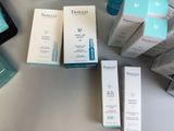 many different types of skin care products sitting on a table