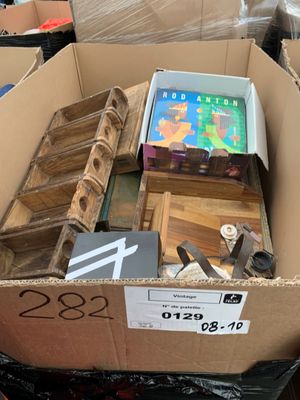 a cardboard box full of assorted items in a store
