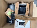 a box full of electronics that is sitting on the floor