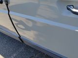 a close up of a car door handle with a cord attached to it