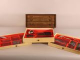 three wooden boxes with silverware in them on a table