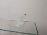 a glass table with a glass vase on it