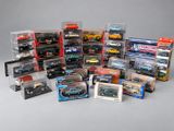 a lot of toy cars in a display case on a table