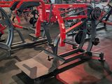 a gym with a lot of machines in it