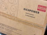 a box of electrical tools on the floor next to a pile of boxes