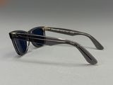 Lunettes de soleil Ray-Ban en noir et argent avec des verres bleus