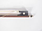 a white and black pen and a black and gold pen