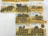 a lot of coins in the bags on the table