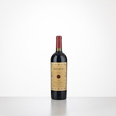 a bottle of red wine sitting on top of a table