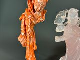 two figurines that are sitting next to each other