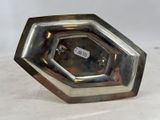 a silver plate that has a label on it