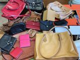 many purses that are sitting on a table