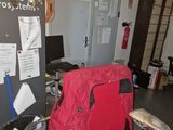 a red chair and a red chair in a room