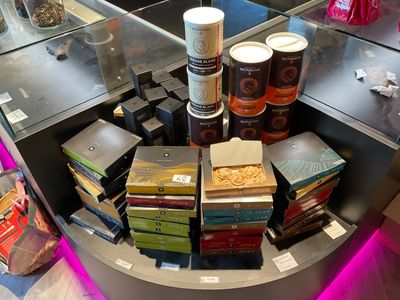 many boxes of food on the counter in the store
