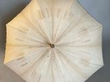 a white umbrella that is sitting on a table