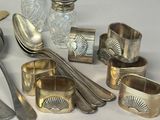 silverware and silverware on a table with spoons and spoons