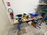 a workbench in a garage with tools on it