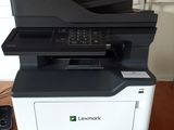 a close up of a printer on a wooden table