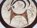 a picture of a ceramic plate with a goat on it