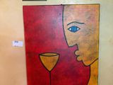 a painting on the wall next to a lamp
