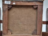 a picture of an old wooden easel with a number 73 on it