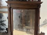 a mirror that is sitting on the floor in front of a mirror