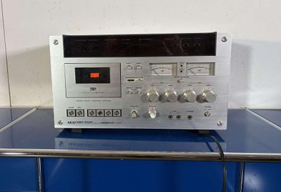 the radio is sitting on top of the blue counter