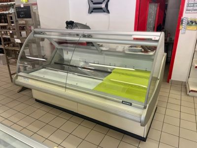 a display case in a store with a lot of food in it