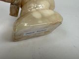 a figurine of a horse that is sitting on a table