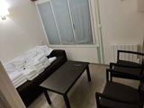 a small living room with a couch and a coffee table