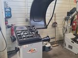a machine that is sitting in a garage next to another machine