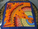 a table with a colorful table cloth on it