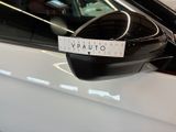 a sticker on the side mirror of a white car