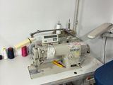 a sewing machine sitting on a table in a room