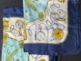 an image of a blue and yellow scarf with a pocket on it