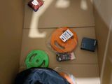 a cardboard box with various items inside of it