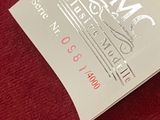 a red cloth with a white and black logo on it