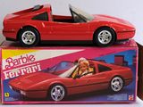 a red toy car sitting on top of a box