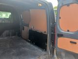a black van with two doors open and a black car in the back