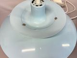 a light blue ceiling lamp with a white cord attached to it