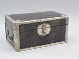 a black and silver box on a white surface