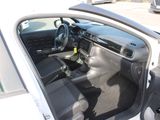 a car that is sitting in a parking lot with its door open