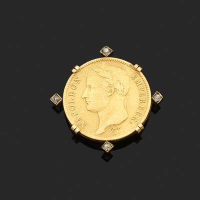 une pièce « sovereign » en or et une broche sertie de diamants