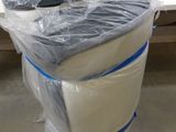 a toilet that is wrapped in plastic and sitting on the floor