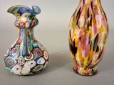 two vases sitting next to each other on a table