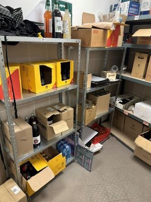 a room with a lot of boxes and boxes on the shelves