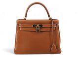 a brown leather handbag on a white background