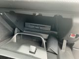 the interior of a car with a dvd player in the center of the console