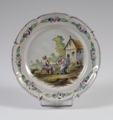 une assiette avec l'image d'une femme et d'un enfant