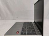 an open laptop computer sitting on top of a white surface